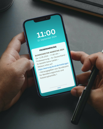 Handy mit Probewarnung